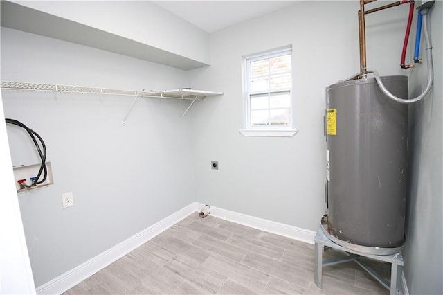 laundry area with electric water heater and electric dryer hookup