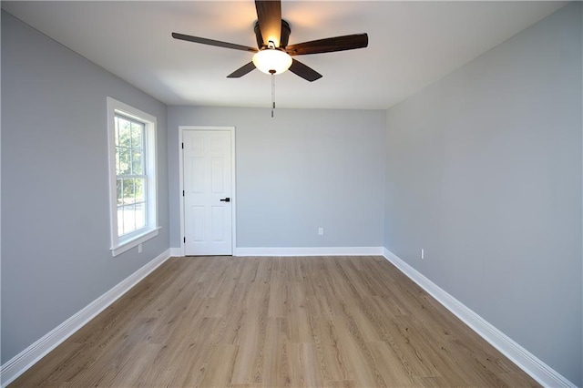 unfurnished room featuring ceiling fan and light hardwood / wood-style floors