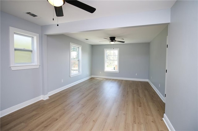 spare room featuring ceiling fan and light hardwood / wood-style floors