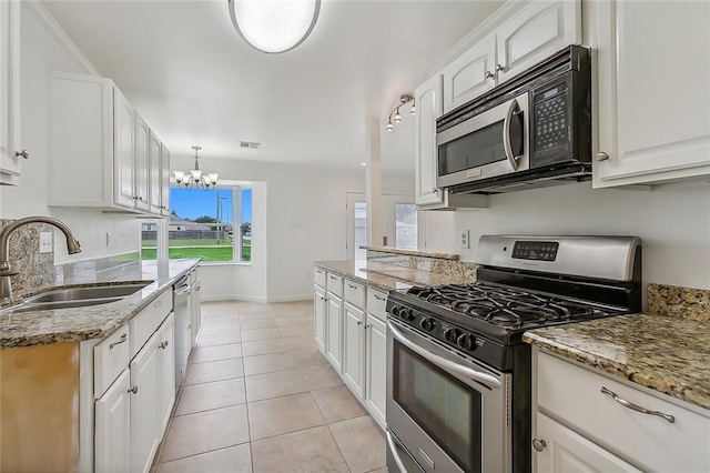 kitchen featuring white cabinets, stainless steel appliances, and sink