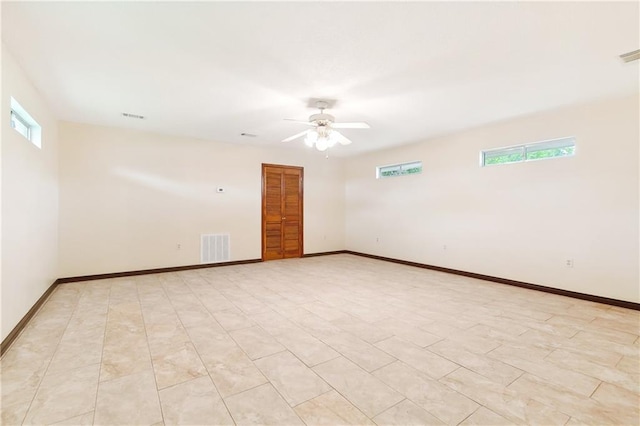 empty room featuring ceiling fan