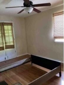 interior space with ceiling fan and hardwood / wood-style flooring