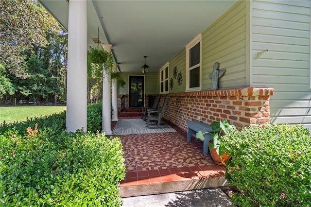 property entrance with covered porch