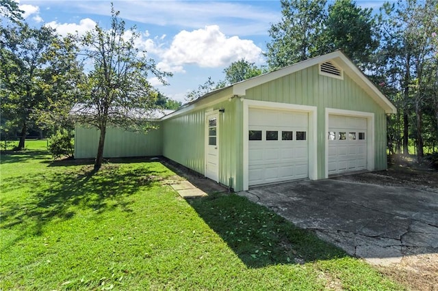 garage featuring a yard