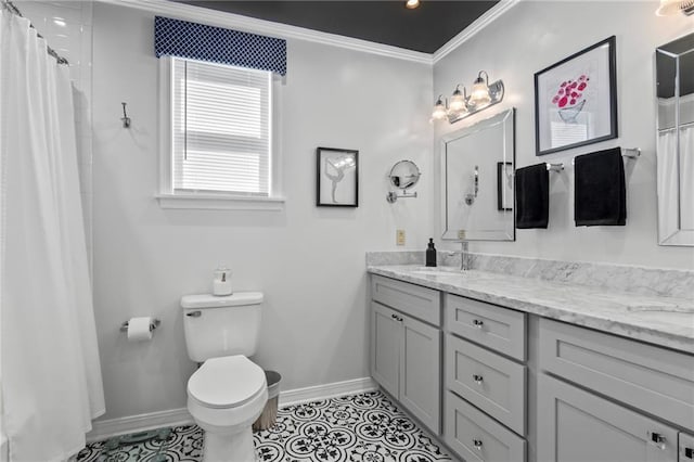 bathroom with tile patterned flooring, vanity, toilet, and ornamental molding