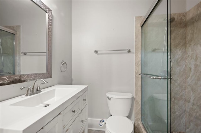 bathroom with vanity, toilet, and walk in shower