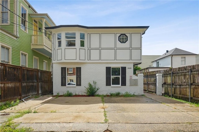 rear view of house with a balcony