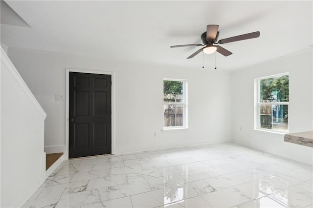 unfurnished room with plenty of natural light and ceiling fan