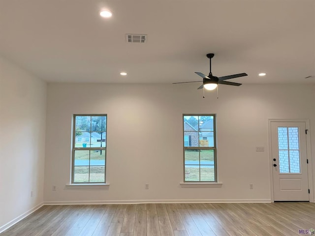 interior space featuring ceiling fan and light hardwood / wood-style flooring