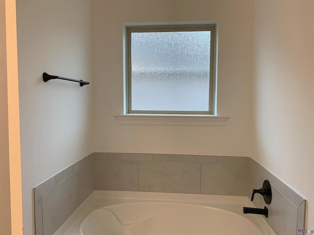 bathroom featuring a tub to relax in