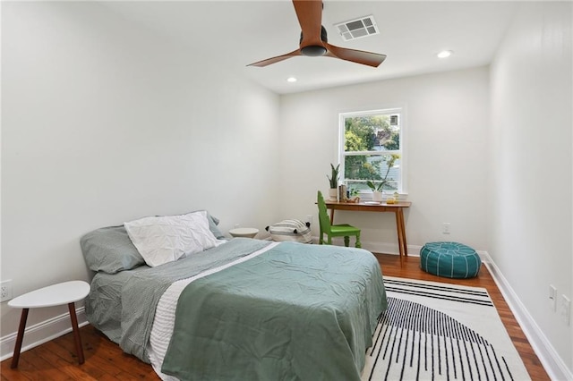 bedroom with wood-type flooring and ceiling fan