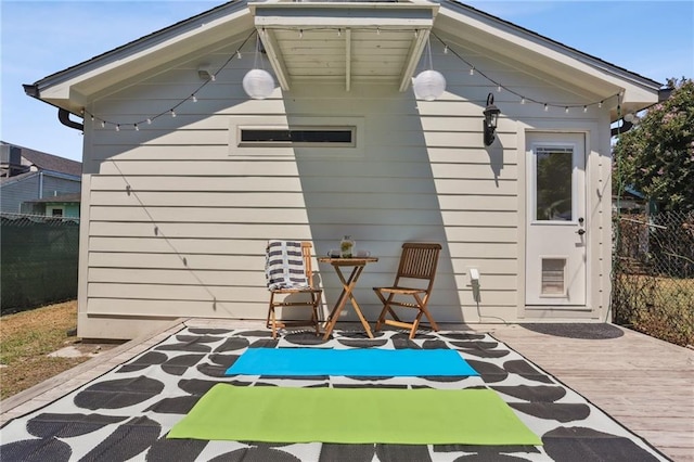 exterior space featuring hardwood / wood-style flooring and wooden walls