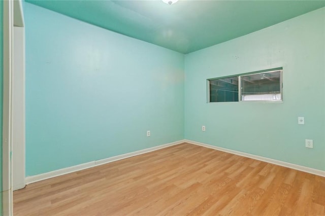 spare room with light wood-type flooring