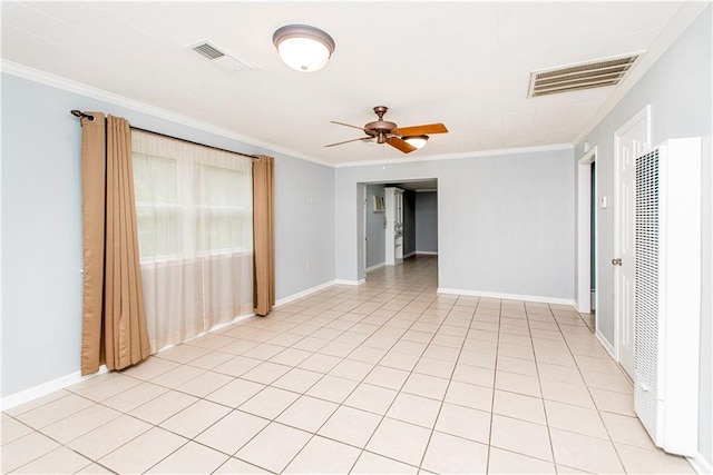 unfurnished room featuring ceiling fan, crown molding, and light tile patterned flooring