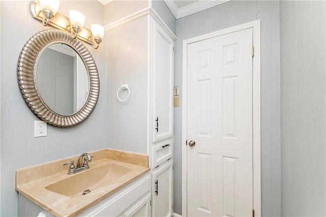 bathroom with vanity and ornamental molding