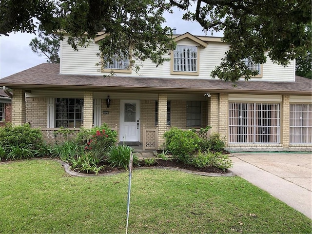 view of front of house with a front lawn and covered porch