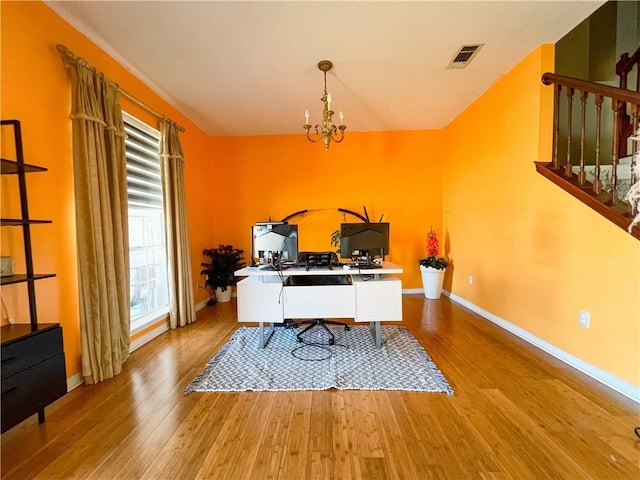 office featuring a notable chandelier and light wood-type flooring