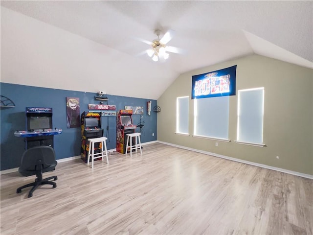 office featuring lofted ceiling, hardwood / wood-style flooring, and ceiling fan