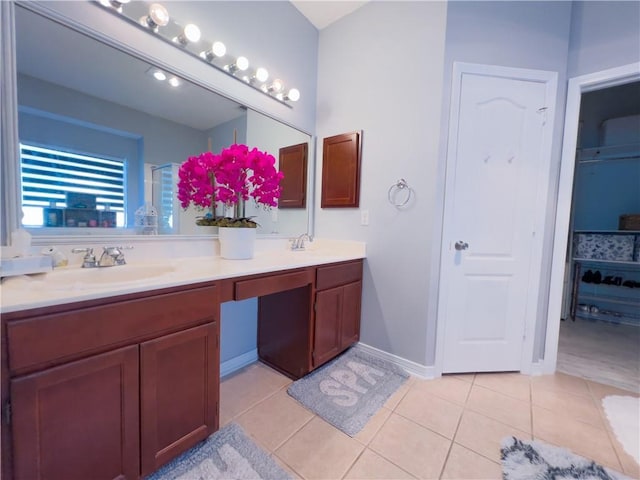 bathroom with tile patterned flooring and vanity