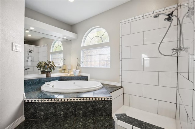 bathroom with recessed lighting, tiled shower, and a bath