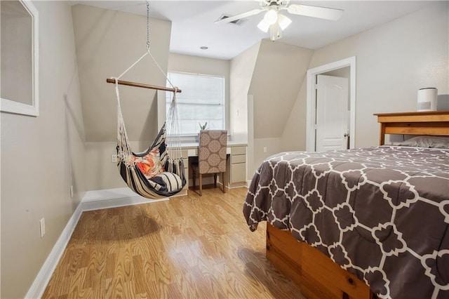 bedroom with ceiling fan and light hardwood / wood-style flooring