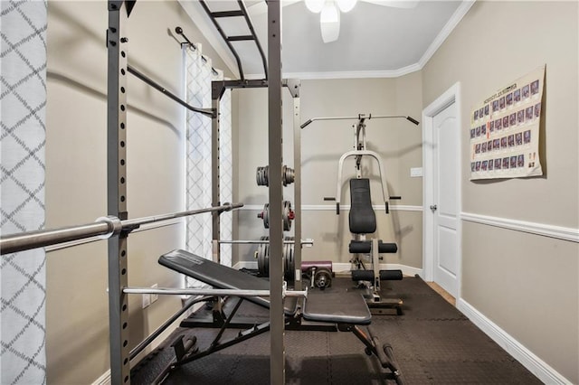 exercise area featuring ornamental molding, baseboards, and a ceiling fan