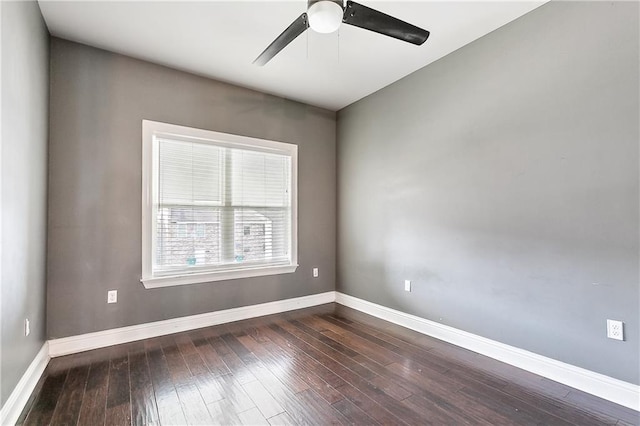 empty room with ceiling fan and dark hardwood / wood-style floors