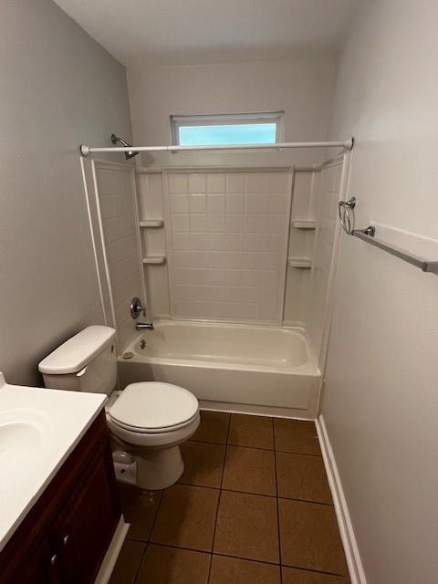 full bathroom featuring toilet, shower / bathtub combination, tile patterned floors, and vanity