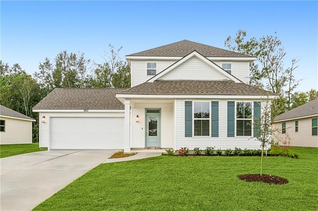 view of front of home with a front lawn and a garage