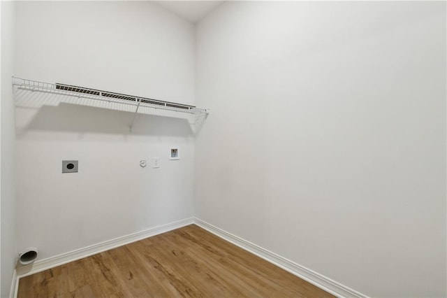 laundry room with electric dryer hookup, washer hookup, and hardwood / wood-style floors