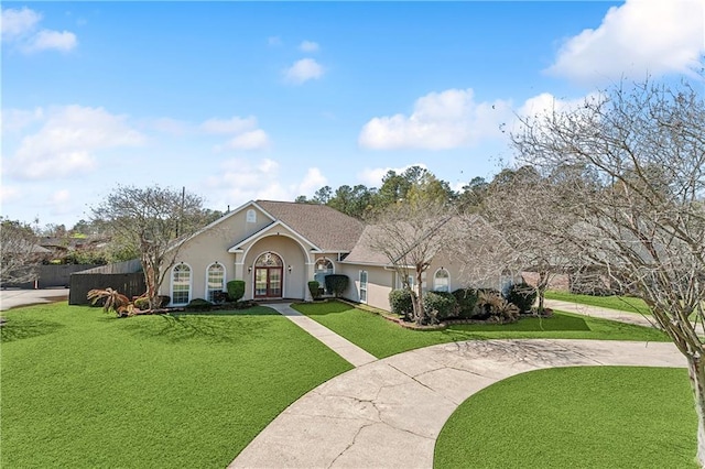 ranch-style home with a front lawn