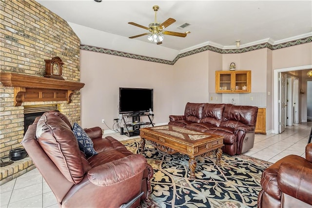 tiled living room with vaulted ceiling, ceiling fan, a fireplace, and crown molding