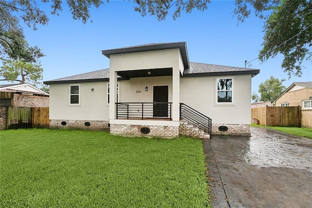 view of front of property with a front lawn