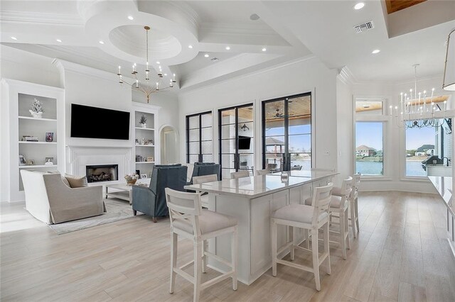 kitchen featuring appliances with stainless steel finishes, a kitchen island with sink, sink, and custom exhaust hood