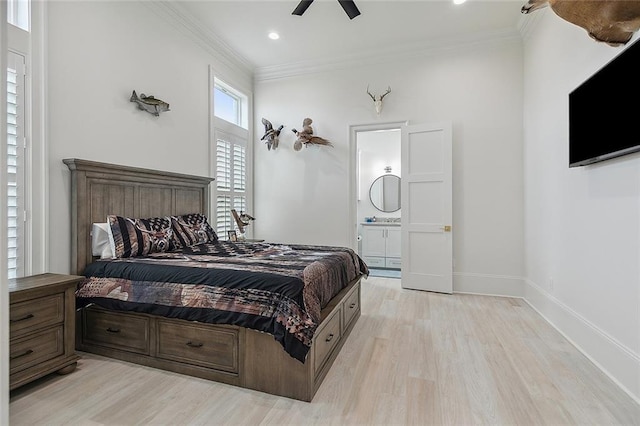 bedroom with ornamental molding, ensuite bath, light hardwood / wood-style flooring, and ceiling fan