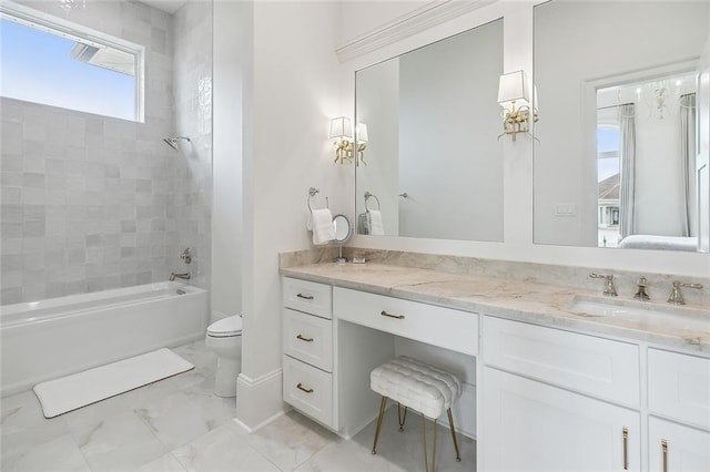 full bathroom with tiled shower / bath combo, vanity, and toilet