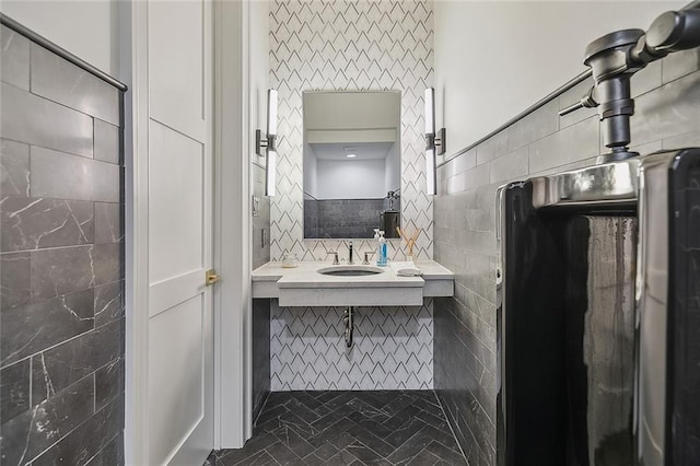 bathroom featuring decorative backsplash, tile walls, tile patterned flooring, and vanity