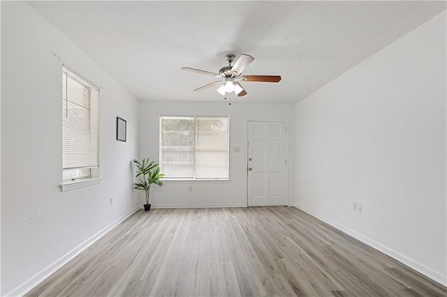 unfurnished room featuring light hardwood / wood-style flooring and ceiling fan