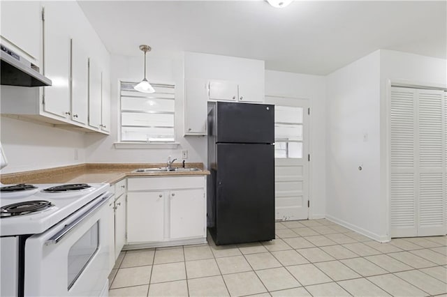 kitchen with pendant lighting, white electric range, black refrigerator, sink, and white cabinets