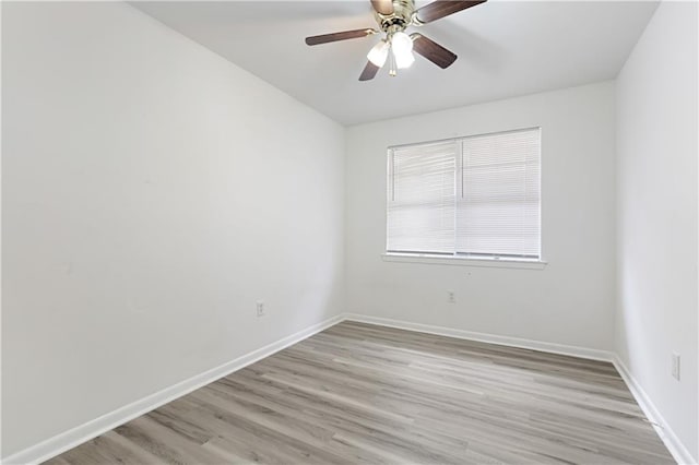 unfurnished room with light wood-type flooring and ceiling fan