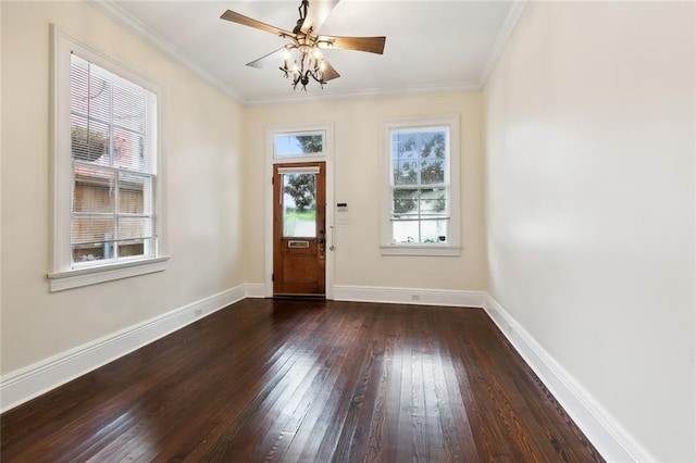 entrance foyer featuring ceiling fan, ornamental molding, and dark wood-type flooring