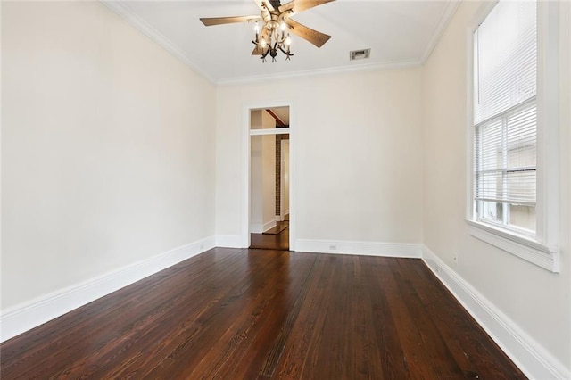 empty room with ceiling fan, crown molding, and dark hardwood / wood-style flooring