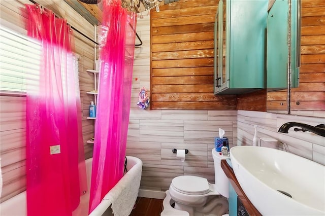 full bathroom featuring shower / bath combo, vanity, and toilet