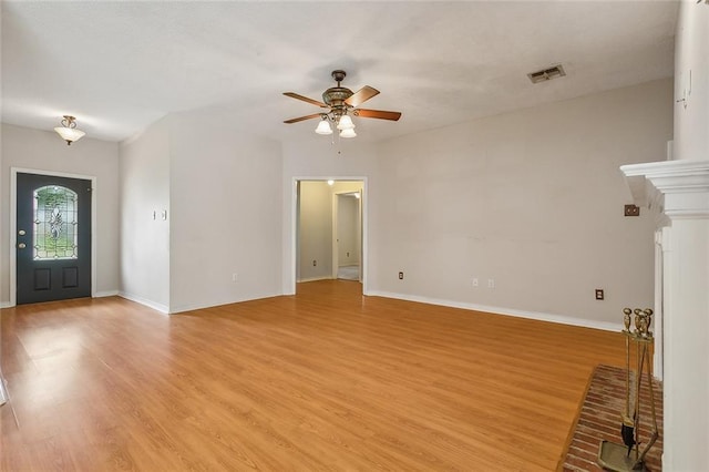 unfurnished living room featuring ceiling fan and light hardwood / wood-style floors