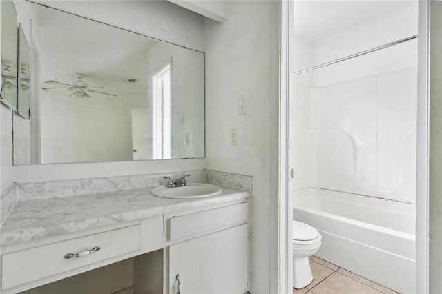 full bathroom with vanity, tile patterned flooring, toilet,  shower combination, and ceiling fan