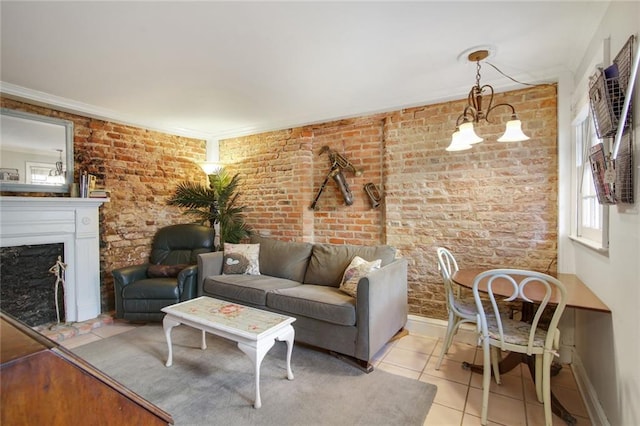 tiled living room with a chandelier, brick wall, and crown molding