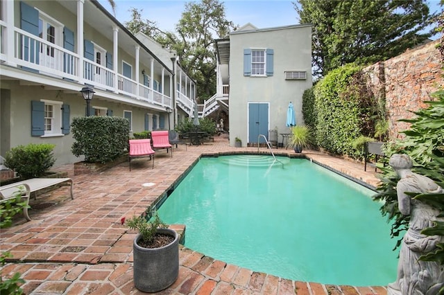 view of pool featuring central AC and a patio area