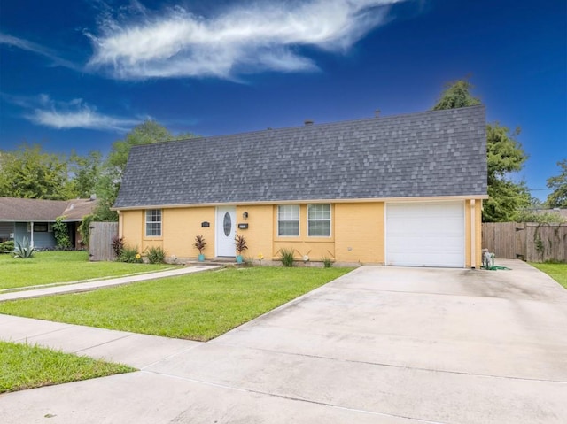 ranch-style house with a garage and a front yard