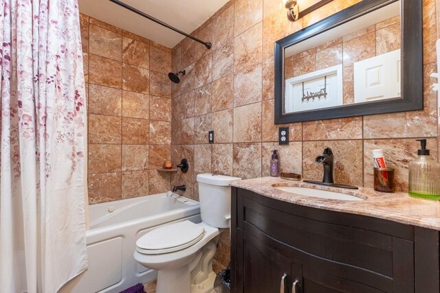 full bathroom with vanity, decorative backsplash, tile walls, and shower / bath combination with curtain