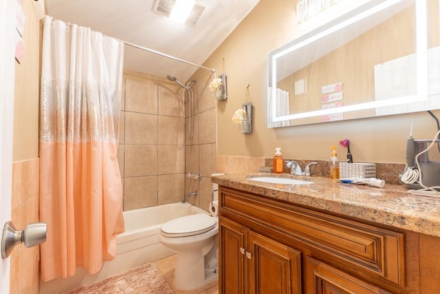 full bathroom featuring toilet, vanity, tile patterned flooring, and shower / bathtub combination with curtain